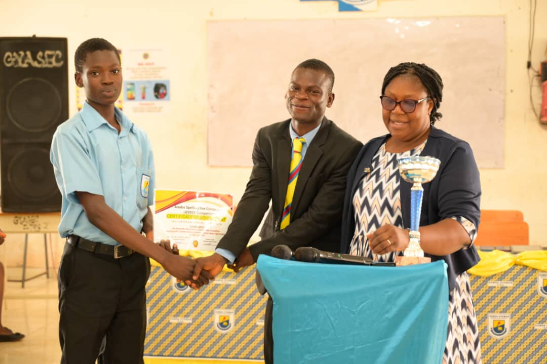 A contestant receiving an ASBEE certificate at Gomoa Gyaman Senior High School